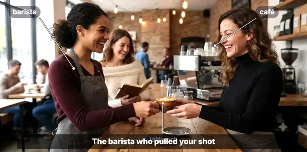 A barista serving a freshly pulled espresso shot on a café counter